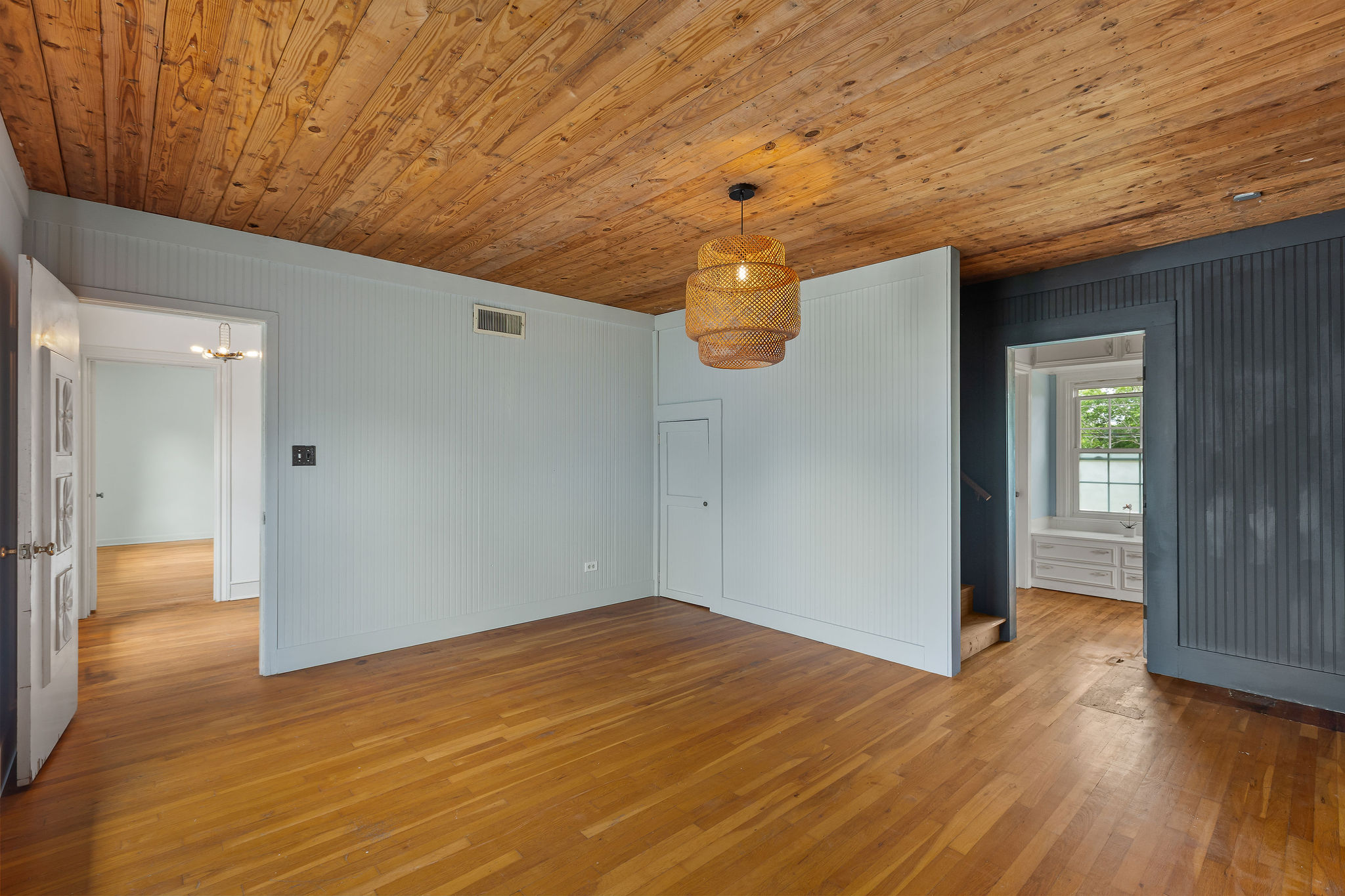 948 Maple Street Lockhart, TX 78644 - Photo 19 of 40 Natural wood flooring and a distinctive ceiling create warmth and character in this inviting space.