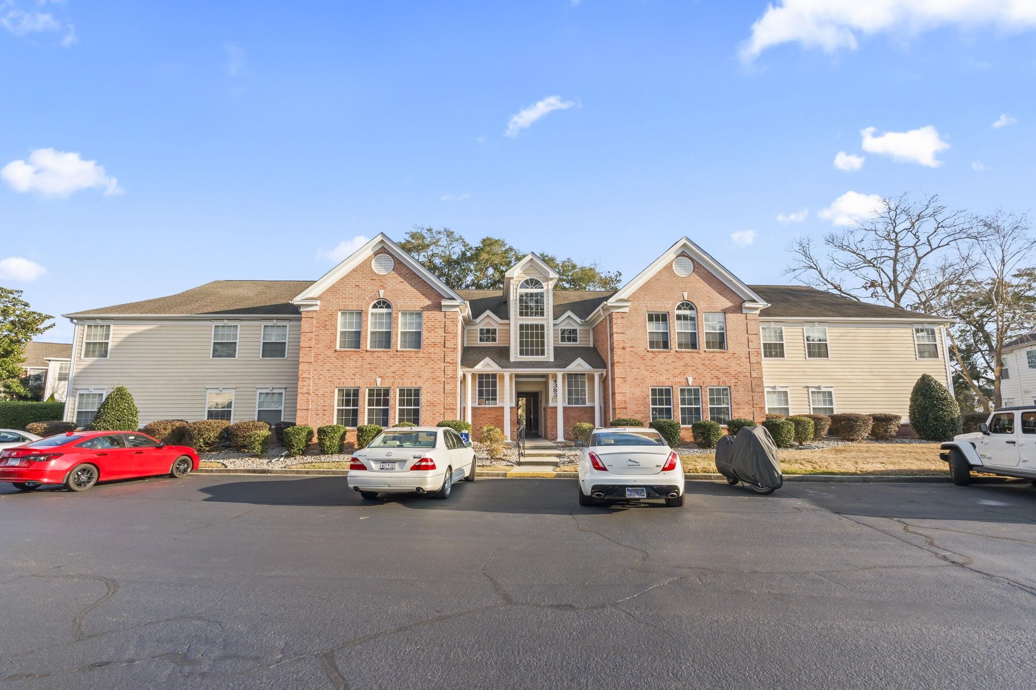4383 Daphne Lane, Unit F Murrells Inlet, SC 29576 - Photo 1 of 35 View of front facade with a residential view, brick siding, and uncovered parking