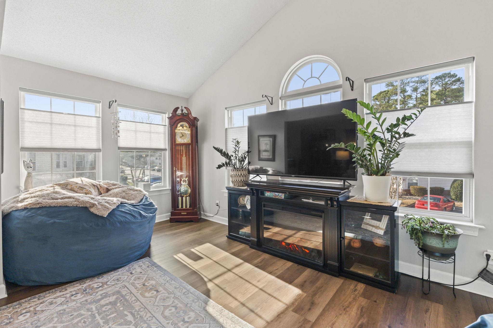 4383 Daphne Lane, Unit F Murrells Inlet, SC 29576 - Photo 16 of 35 Living room with high vaulted ceiling, dark wood-style flooring, and plenty of natural light