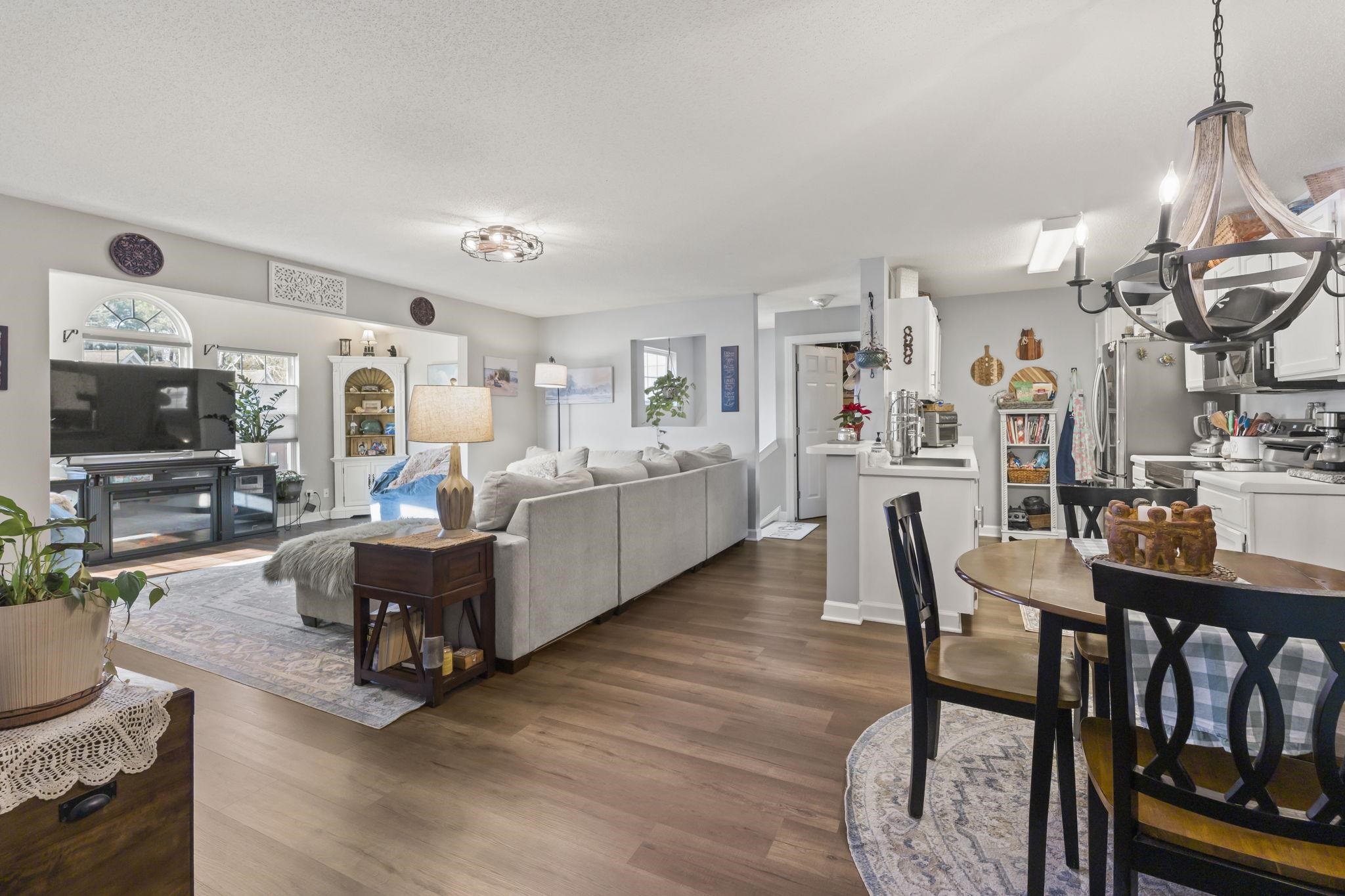 4383 Daphne Lane, Unit F Murrells Inlet, SC 29576 - Photo 18 of 35 Dining space with a chandelier, healthy amount of natural light, and dark wood-style flooring
