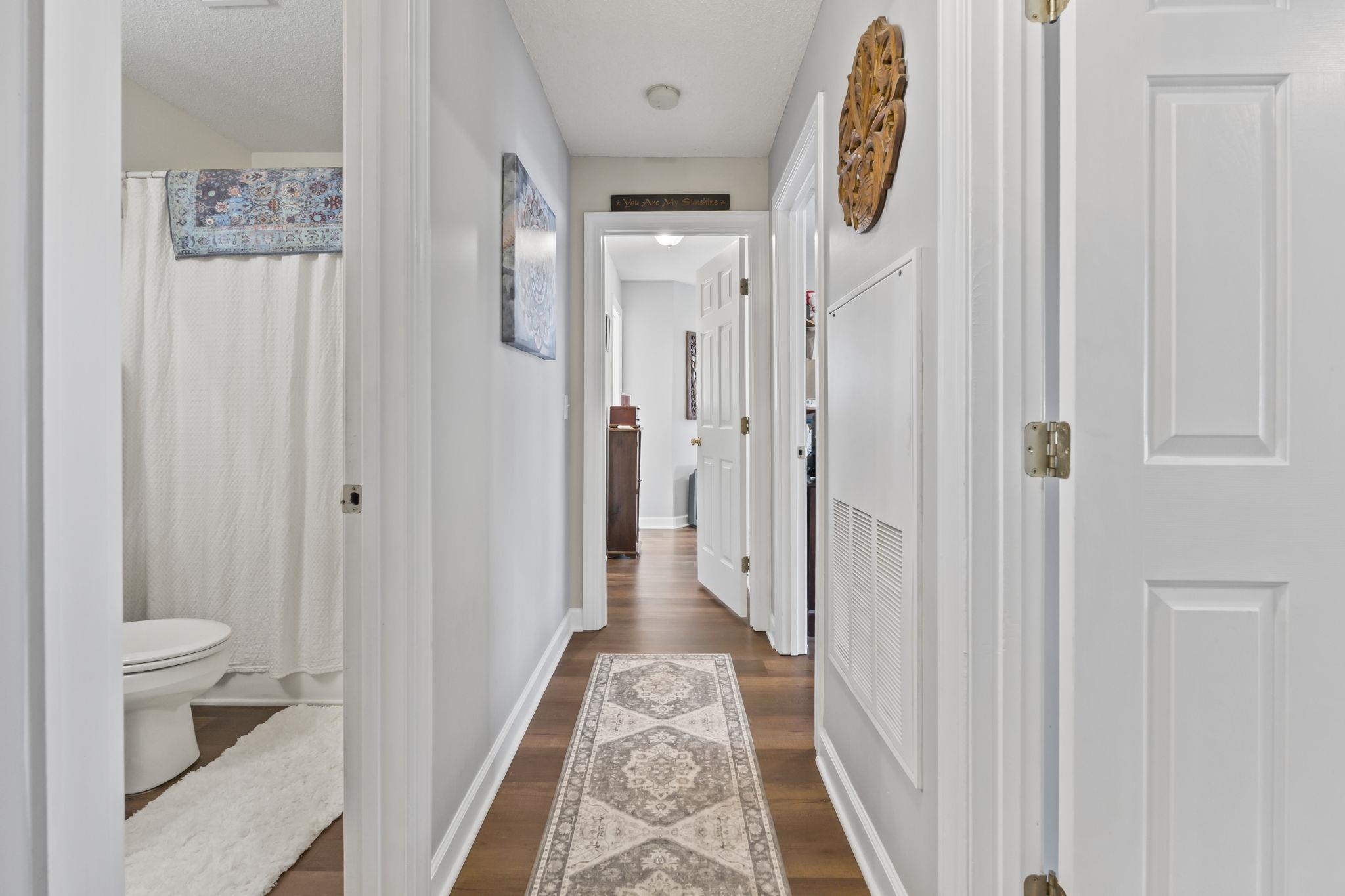 4383 Daphne Lane, Unit F Murrells Inlet, SC 29576 - Photo 19 of 35 Hall featuring dark wood-type flooring and baseboards