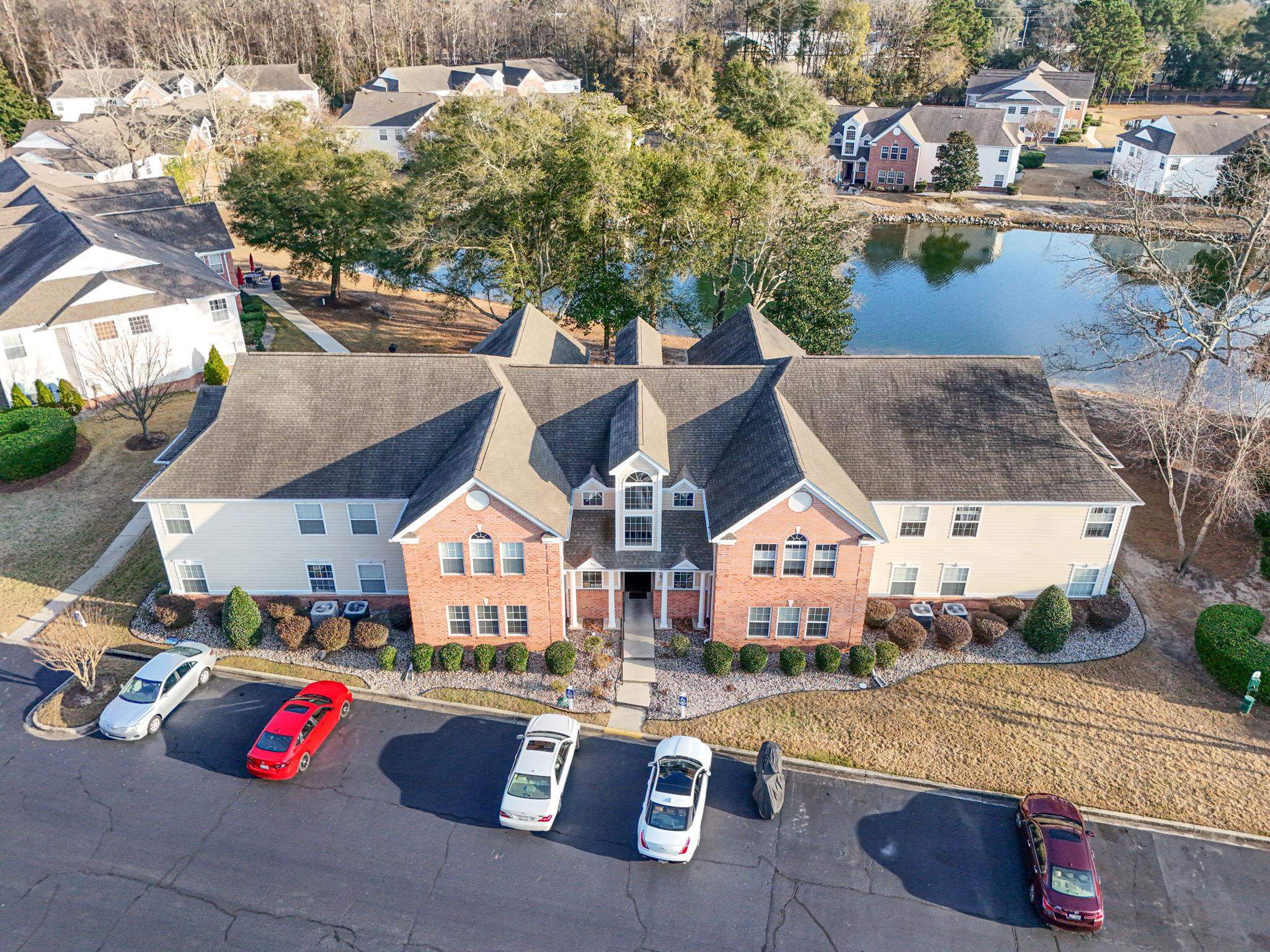 4383 Daphne Lane, Unit F Murrells Inlet, SC 29576 - Photo 2 of 35 Aerial perspective of suburban area with a nearby body of water