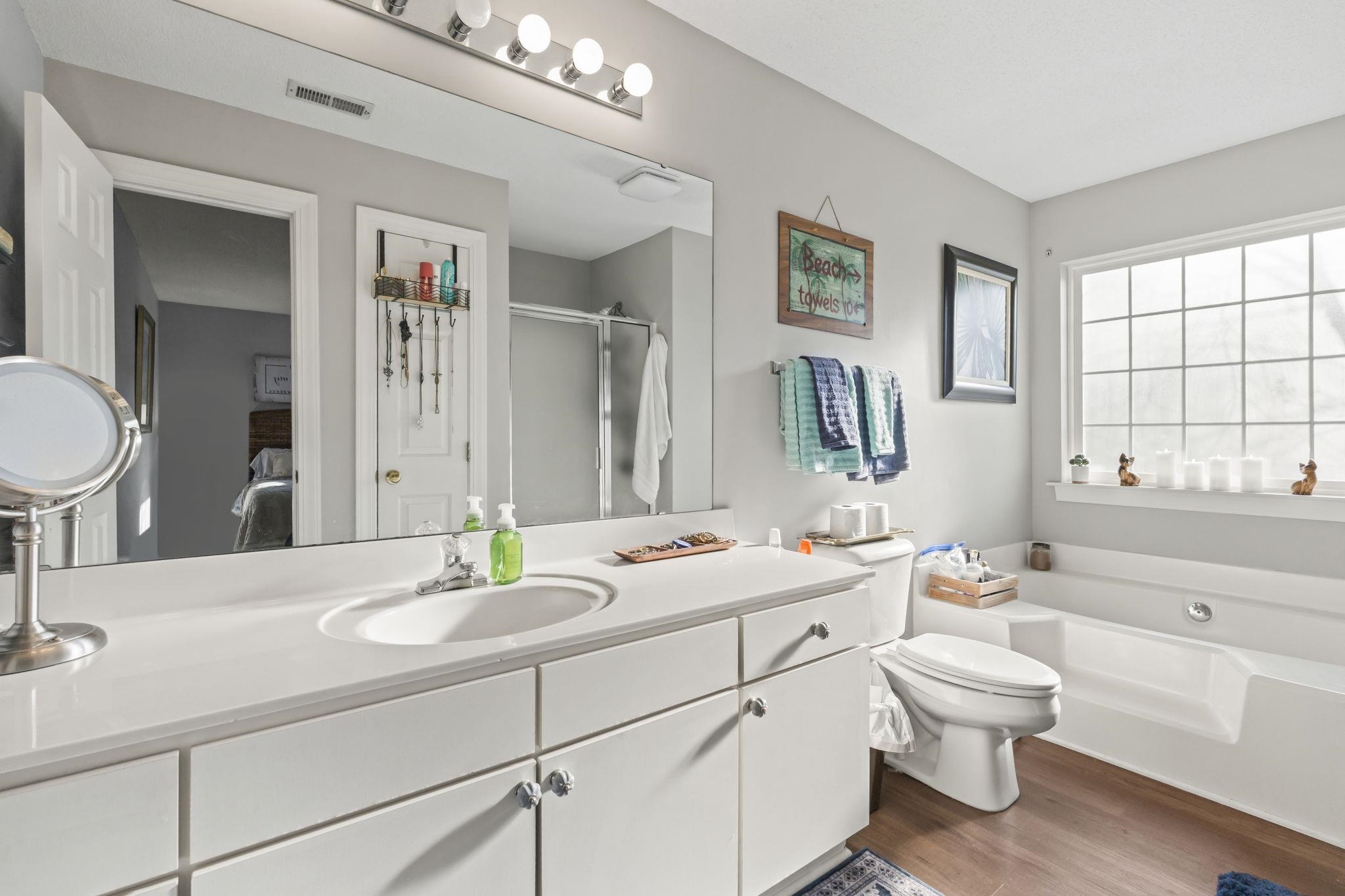 4383 Daphne Lane, Unit F Murrells Inlet, SC 29576 - Photo 24 of 35 Full bath featuring a bath, a stall shower, vanity, and dark wood-style flooring