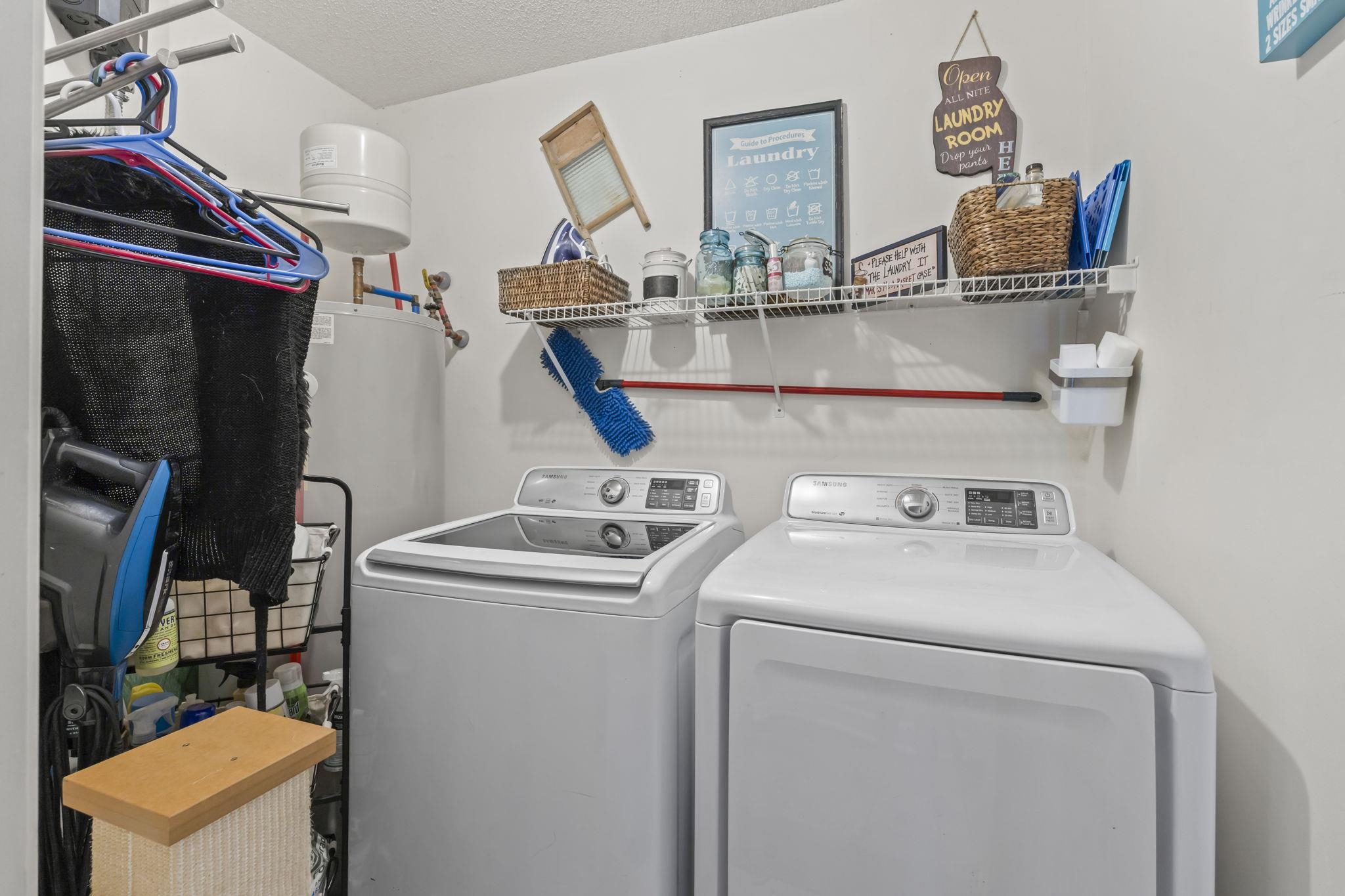 4383 Daphne Lane, Unit F Murrells Inlet, SC 29576 - Photo 29 of 35 Washroom with separate washer and dryer, water heater, and a textured ceiling