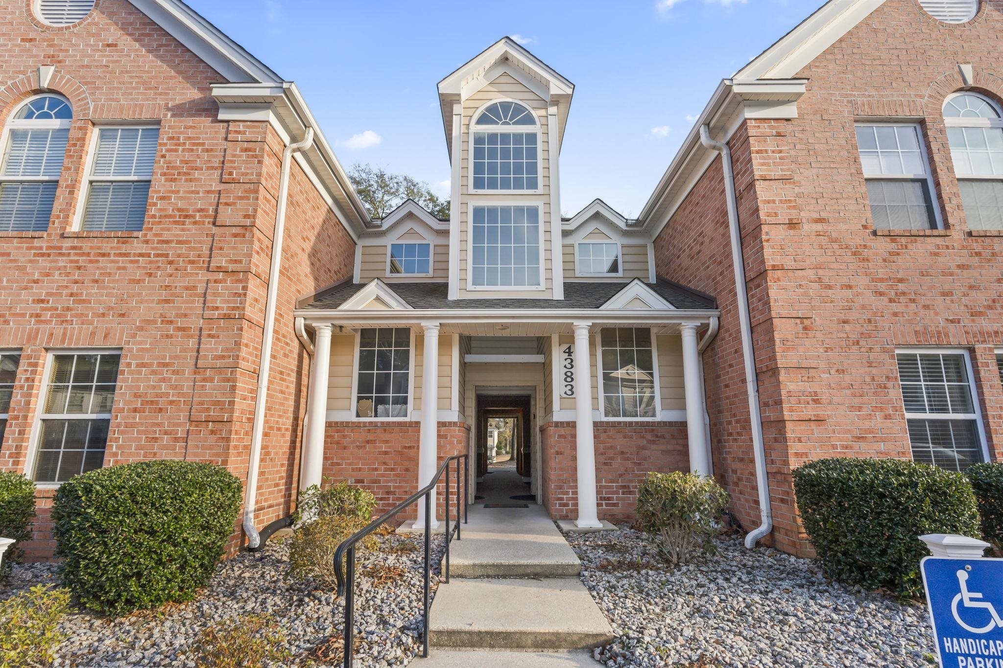 4383 Daphne Lane, Unit F Murrells Inlet, SC 29576 - Photo 4 of 35 View of front of property featuring brick siding and a porch