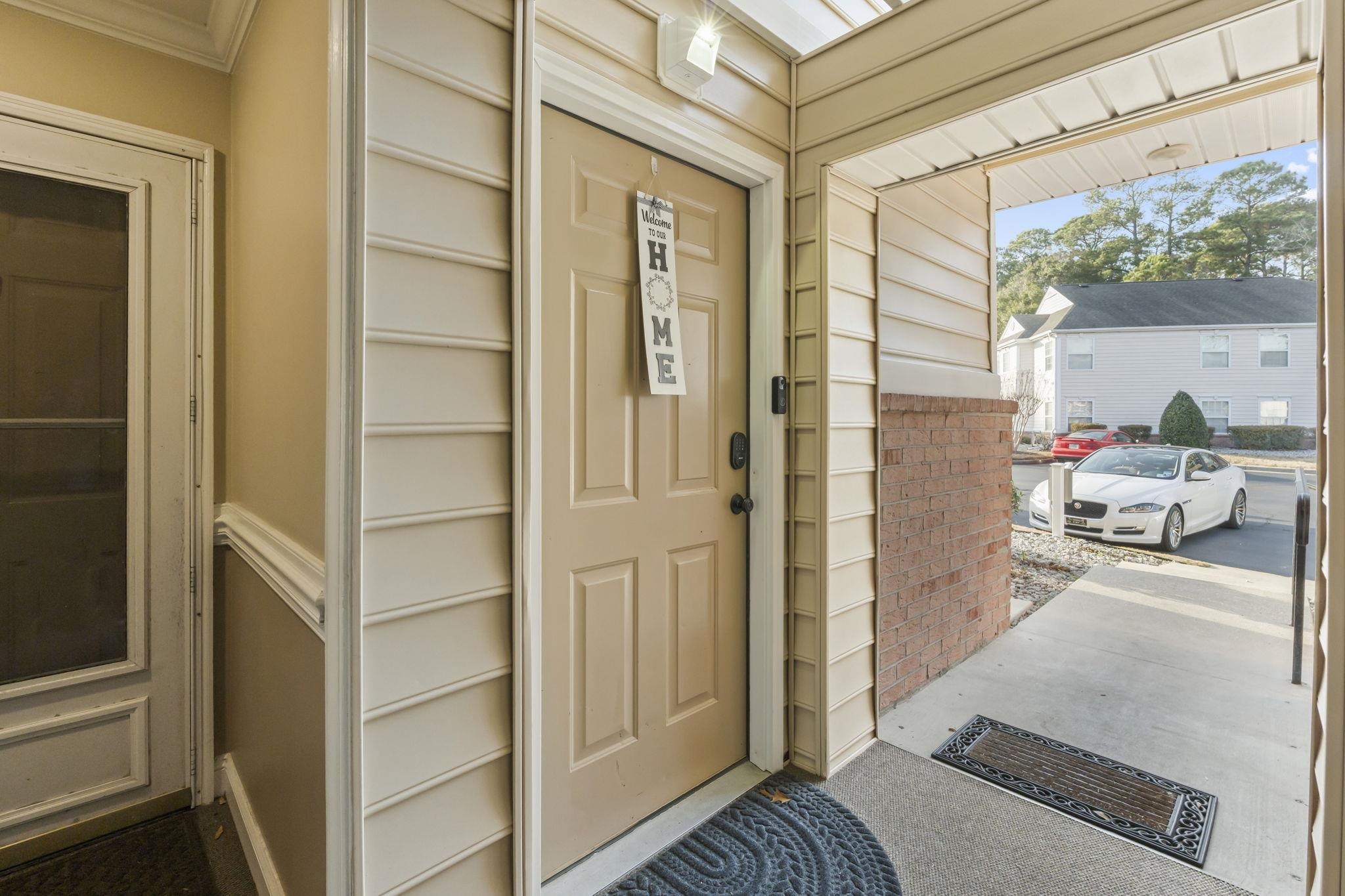 4383 Daphne Lane, Unit F Murrells Inlet, SC 29576 - Photo 5 of 35 View of exterior entry featuring brick siding
