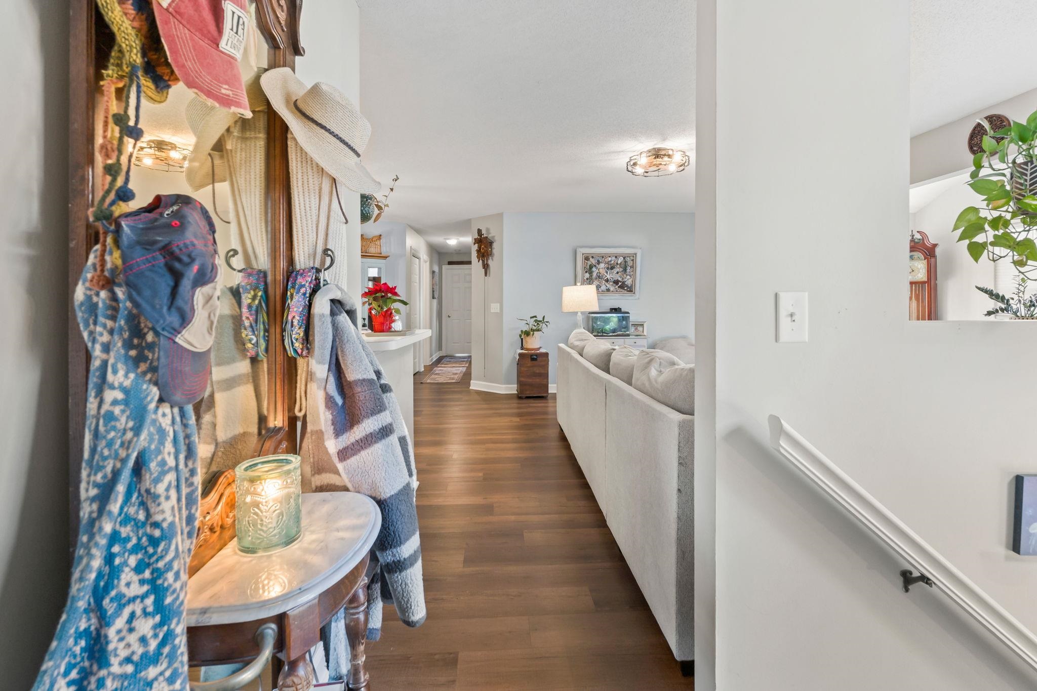 4383 Daphne Lane, Unit F Murrells Inlet, SC 29576 - Photo 7 of 35 Corridor with dark wood finished floors and an upstairs landing
