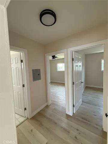 a view of a room with wooden floor