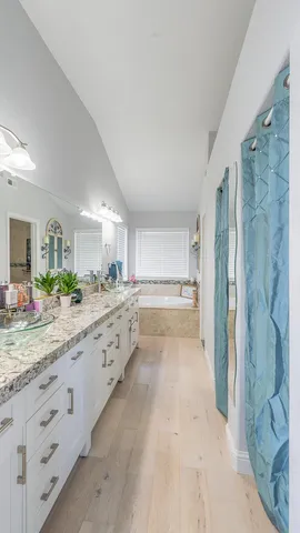 a bath tub sitting in a bathroom next to a window