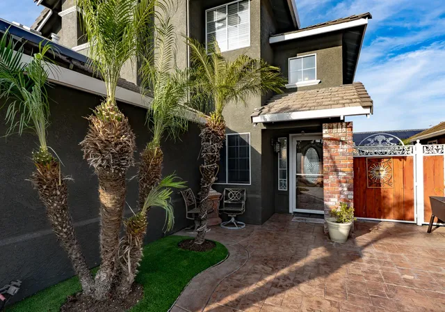 a front view of a house with garden