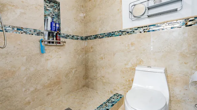 a bathroom with a toilet and a sink