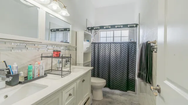 a workspace with wooden floor and a window