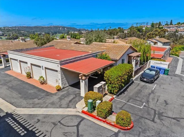 an aerial view of residential houses and outdoor space