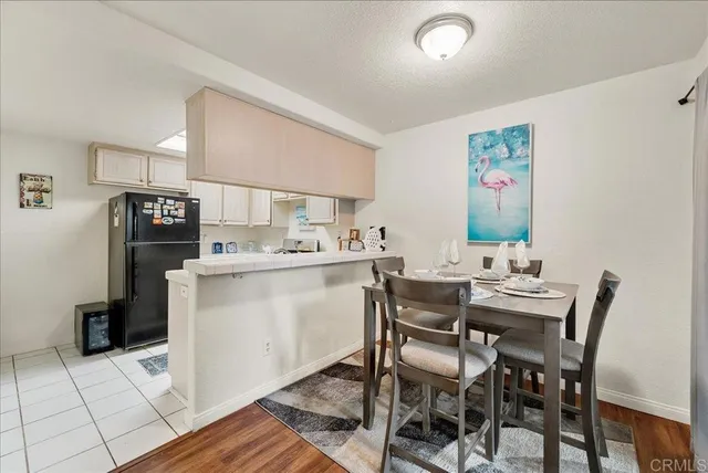 a view of a dining room with furniture and a chandelier