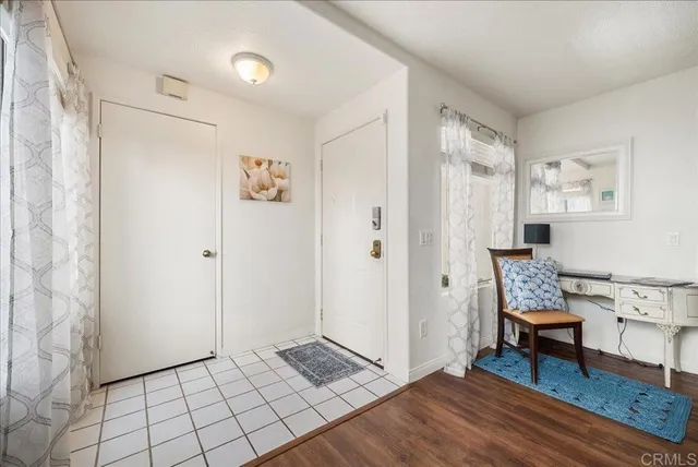 a view of room with furniture and wooden floor