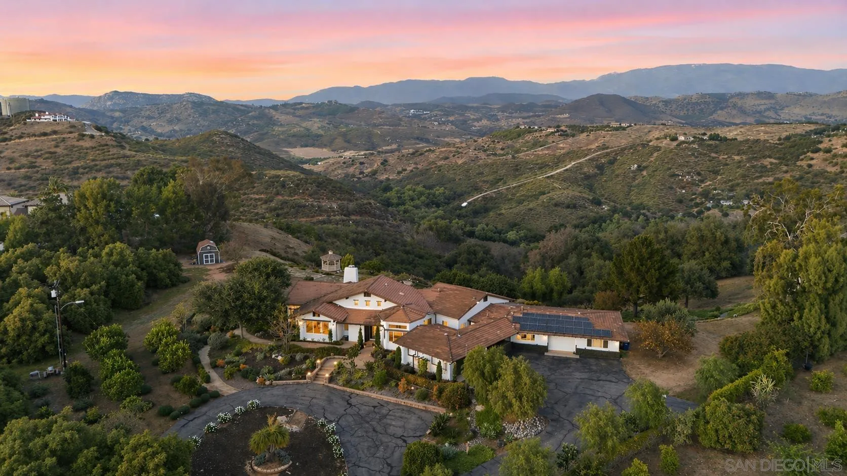 30659 Diaz Road Valley Center, CA 92082 - Photo 35 of 44 an aerial view of green landscape with trees houses and mountain view