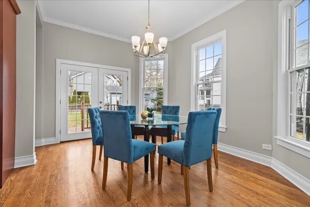 a view of a dining room with furniture wooden floor and chandelier