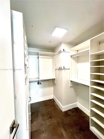 a view of a kitchen with a sink and a window