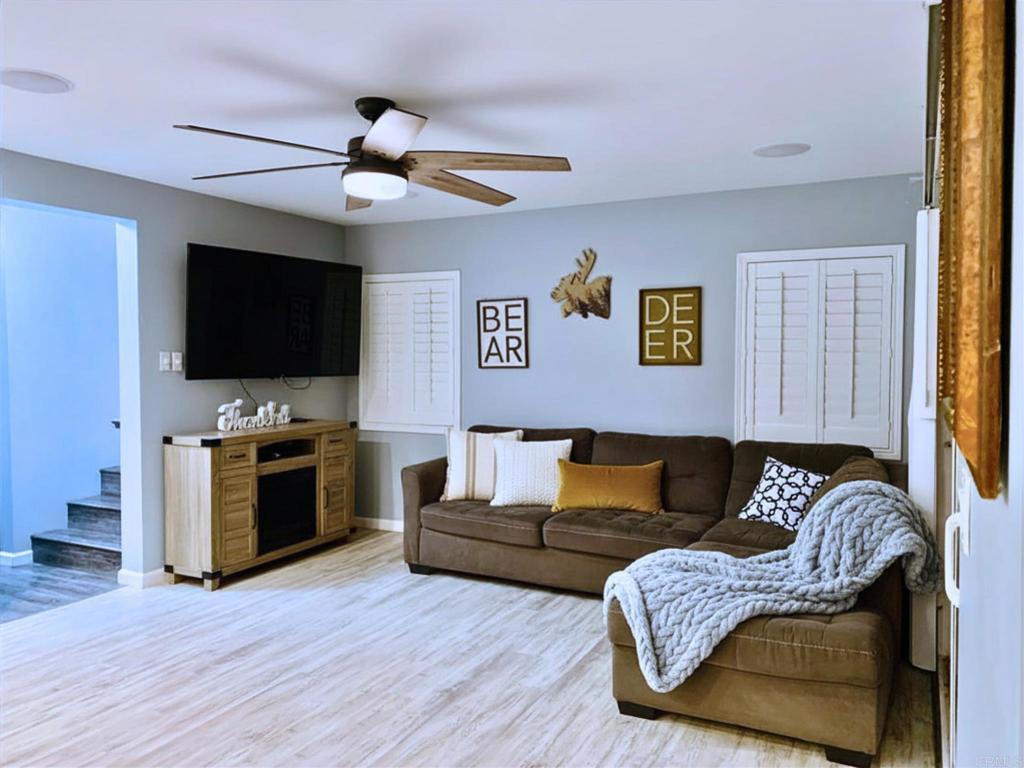 1379 Peach Avenue El Cajon, CA 92021 - Photo 11 of 22 a living room with furniture and a flat screen tv