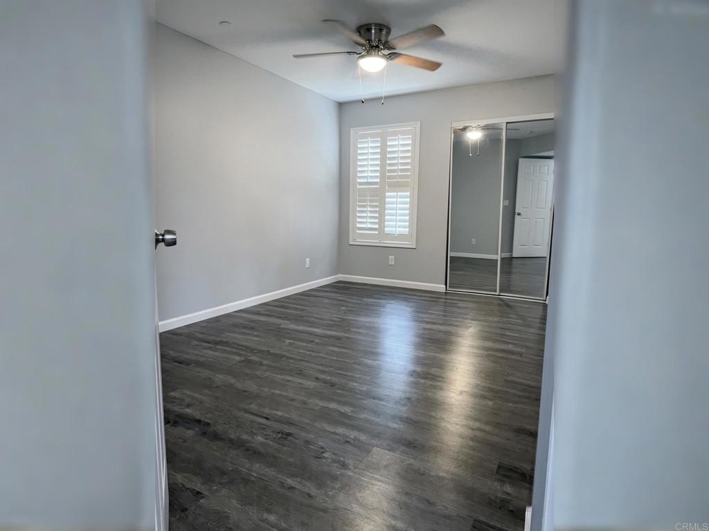 1379 Peach Avenue El Cajon, CA 92021 - Photo 12 of 22 wooden floor in an empty room with a window