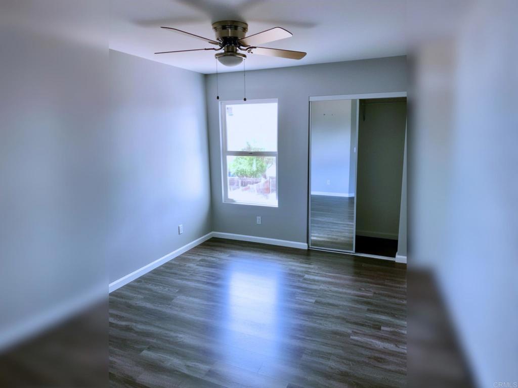 1379 Peach Avenue El Cajon, CA 92021 - Photo 14 of 22 a view of an empty room with window and wooden floor