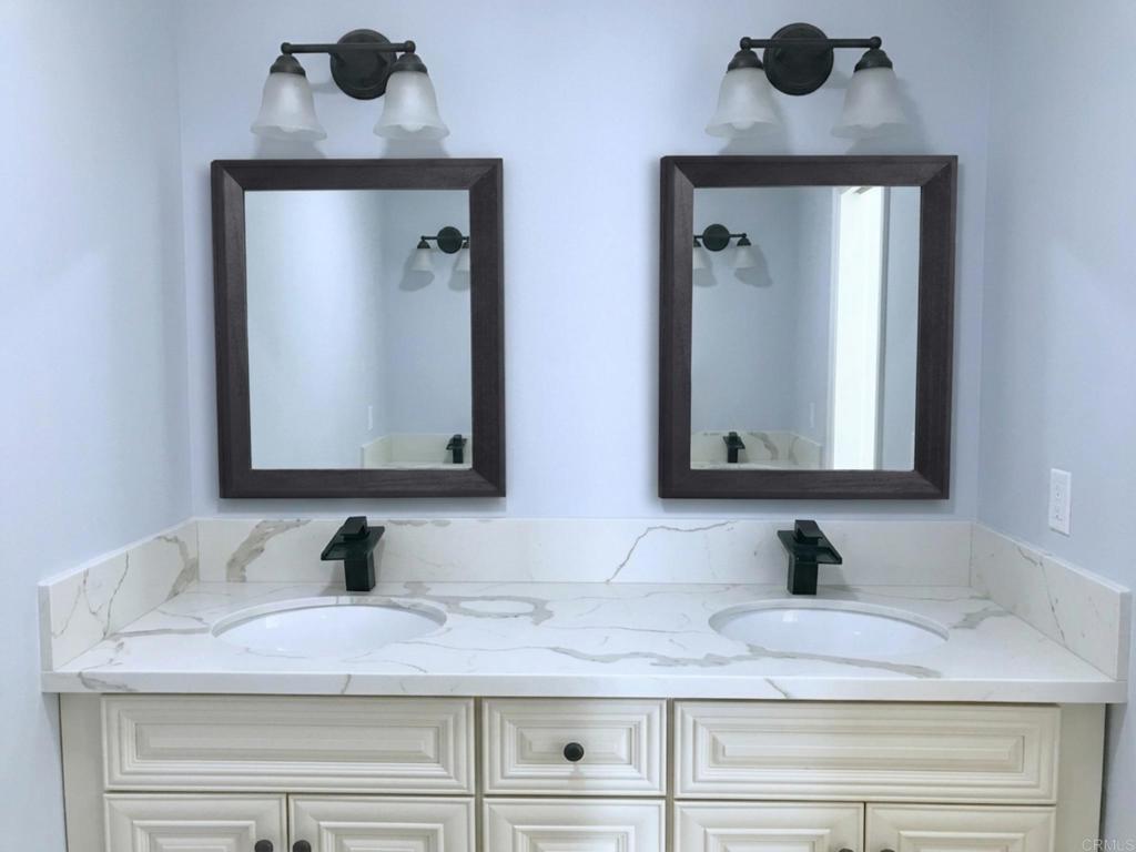 1379 Peach Avenue El Cajon, CA 92021 - Photo 16 of 22 a bathroom with mirror and