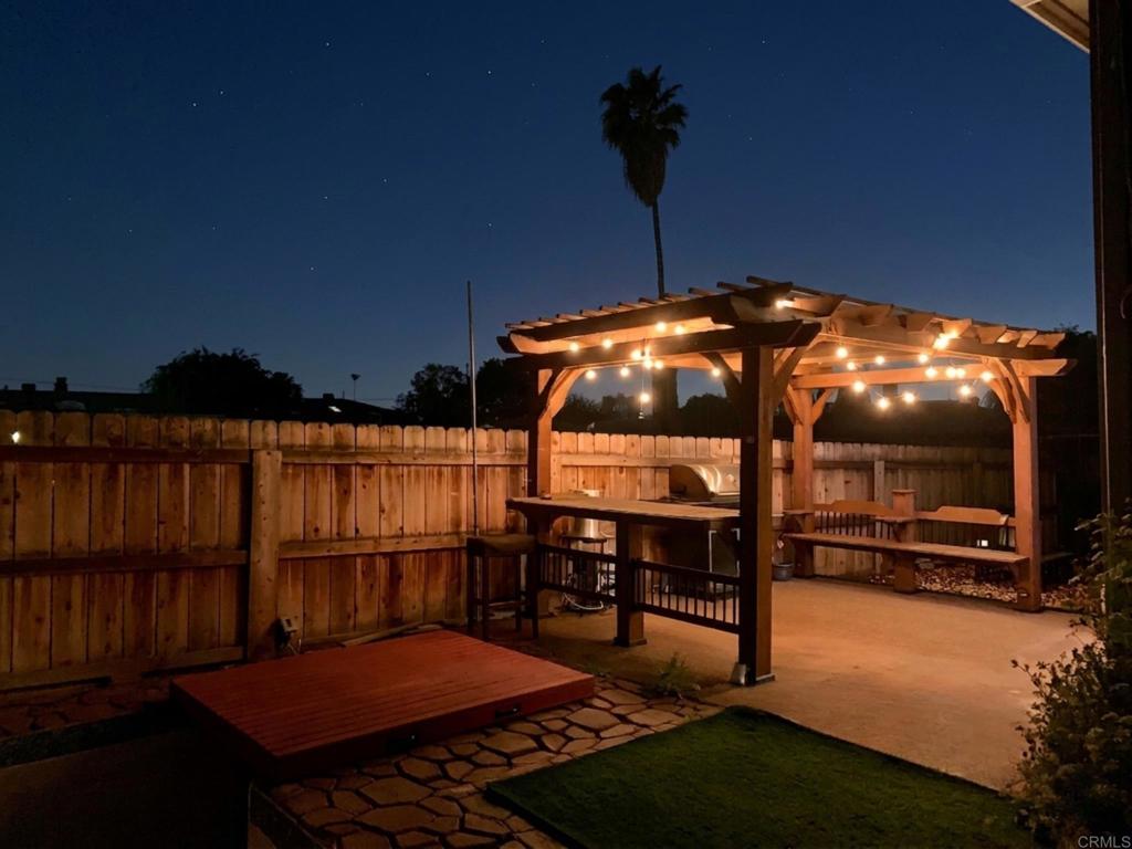 1379 Peach Avenue El Cajon, CA 92021 - Photo 21 of 22 a backyard of a house with table and chairs