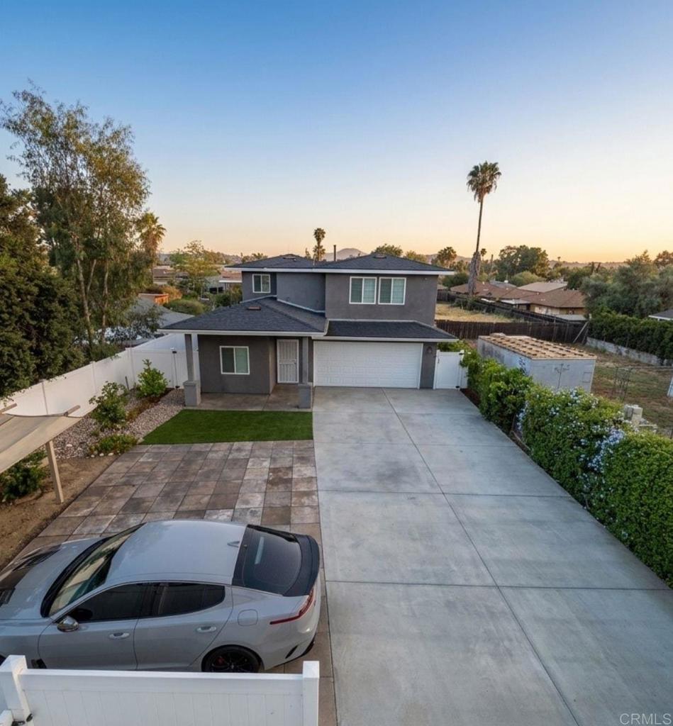 1379 Peach Avenue El Cajon, CA 92021 - Photo 5 of 22 a front view of a house with a yard