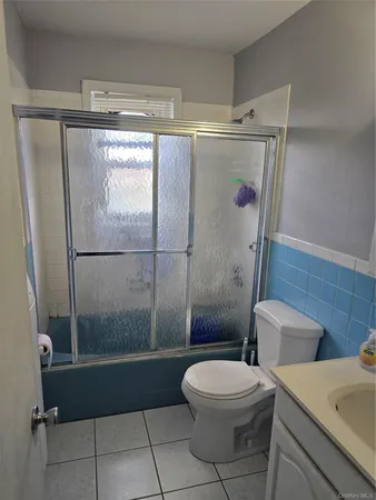 a bathroom with a toilet a sink and shower