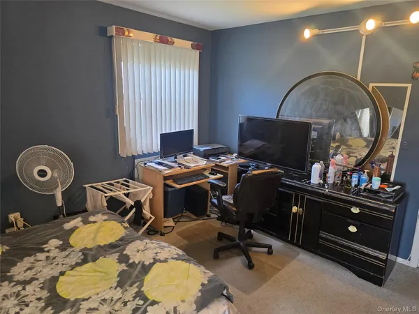 a room with a couch and a mirror