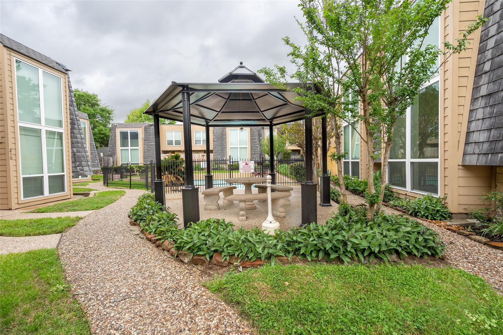 16120 Stuebner Airline Road, Unit 501 Spring, TX 77379 - Photo 11 of 23 a garden view with a seating space