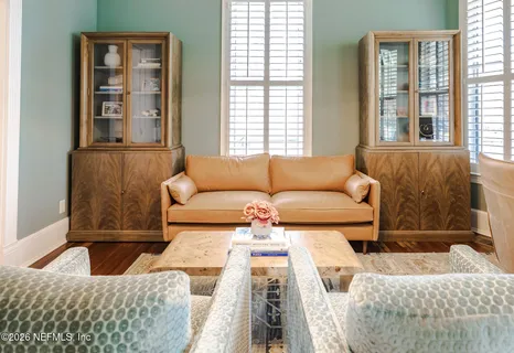 a bathroom with a sink and mirror with painted walls