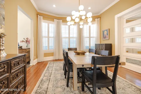 a view of a bedroom with furniture cabinet and window
