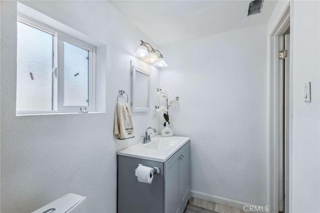 501 B Street Needles, CA 92363 - Photo 15 of 32 a bathroom with a sink and a mirror