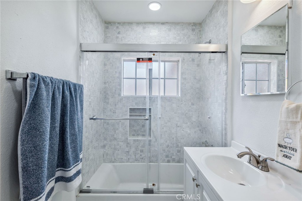 501 B Street Needles, CA 92363 - Photo 17 of 32 a bathroom with a sink and a shower