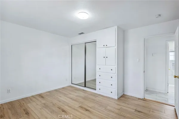 wooden floor with white walls