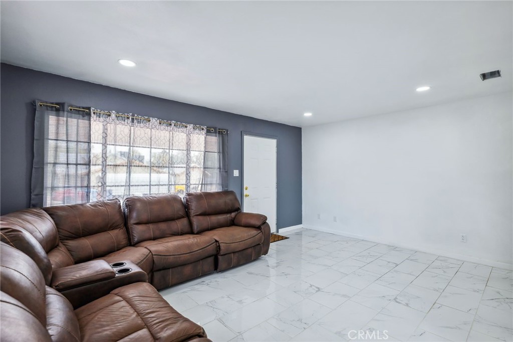 501 B Street Needles, CA 92363 - Photo 8 of 32 a living room with furniture and a large window