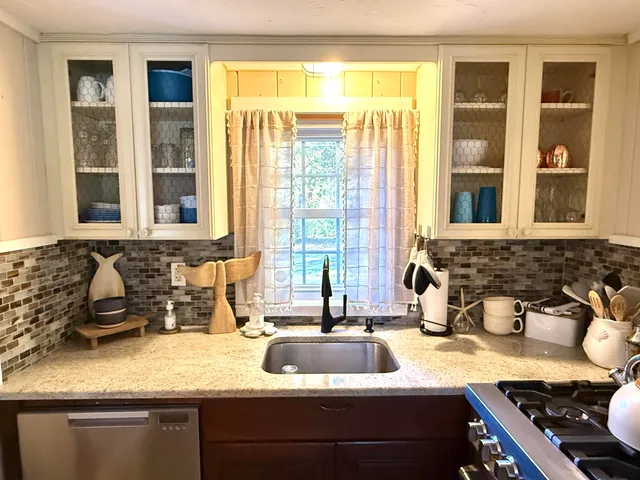 a kitchen with a sink and a window