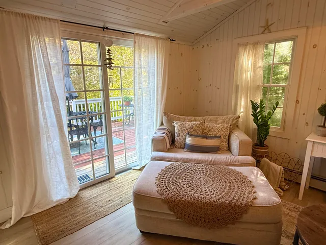 a bedroom with a large bed and a large window