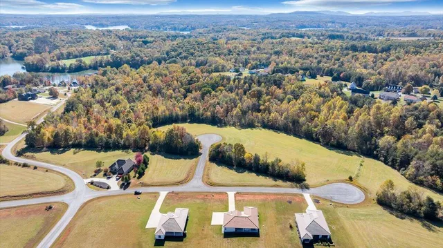 an aerial view of a house with outdoor space