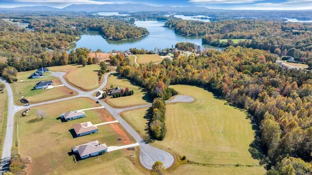 an aerial view of a house with garden space and outdoor seating
