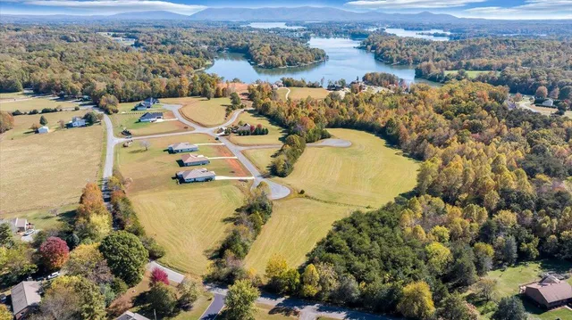 an aerial view of a swimming pool and mountain view