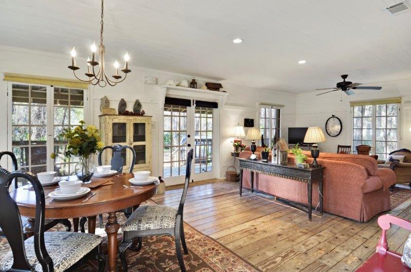 183 Defuniak Street Santa Rosa Beach, FL 32459 - Photo 6 of 15 a view of a dining room with furniture and a chandelier