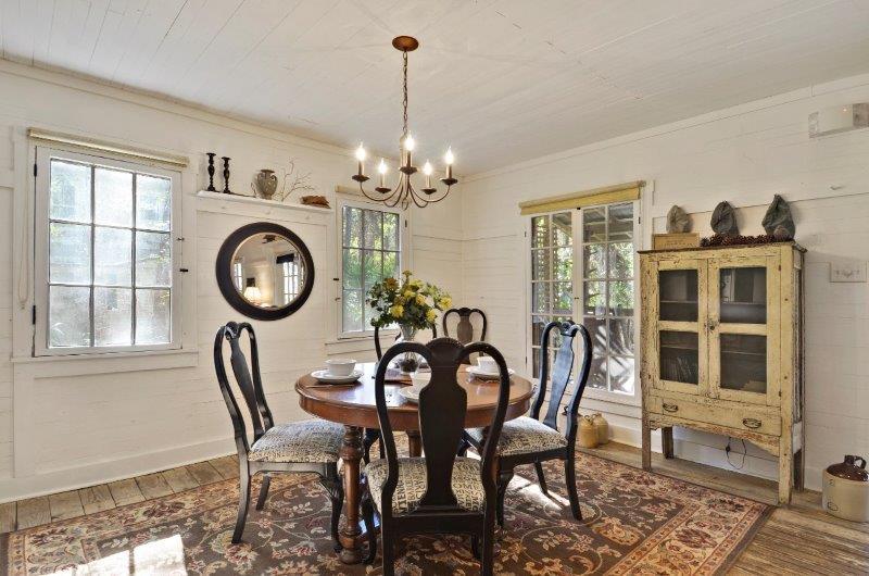 183 Defuniak Street Santa Rosa Beach, FL 32459 - Photo 8 of 15 a view of a dining room with furniture and chandelier