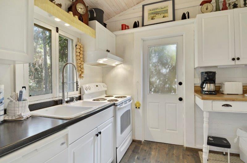 183 Defuniak Street Santa Rosa Beach, FL 32459 - Photo 10 of 15 a spacious bathroom with a sink double vanity and a mirror