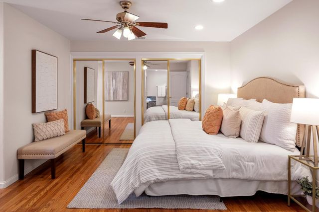 a bedroom with a large bed and a couch