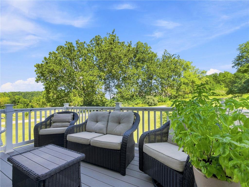 2133 Cross Country Road Northampton, PA 18067 - Photo 12 of 44 Elevated wooden decking framed by classic railings overlooks mature trees and open skies.