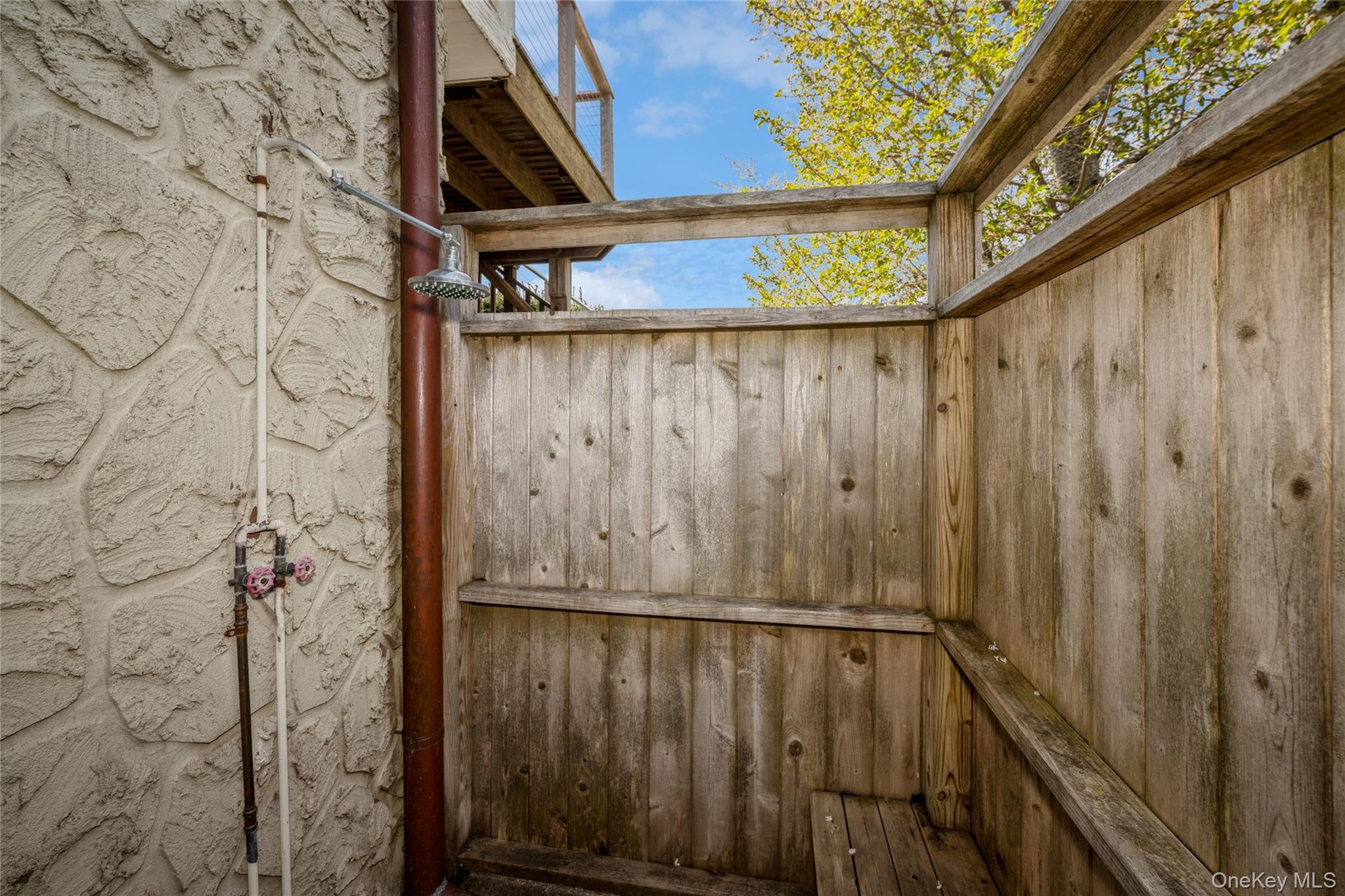 155 Essex Street Montauk, NY 11954 - Photo 11 of 11 a view of a wooden door
