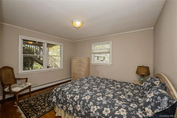 a bedroom with bed and a window