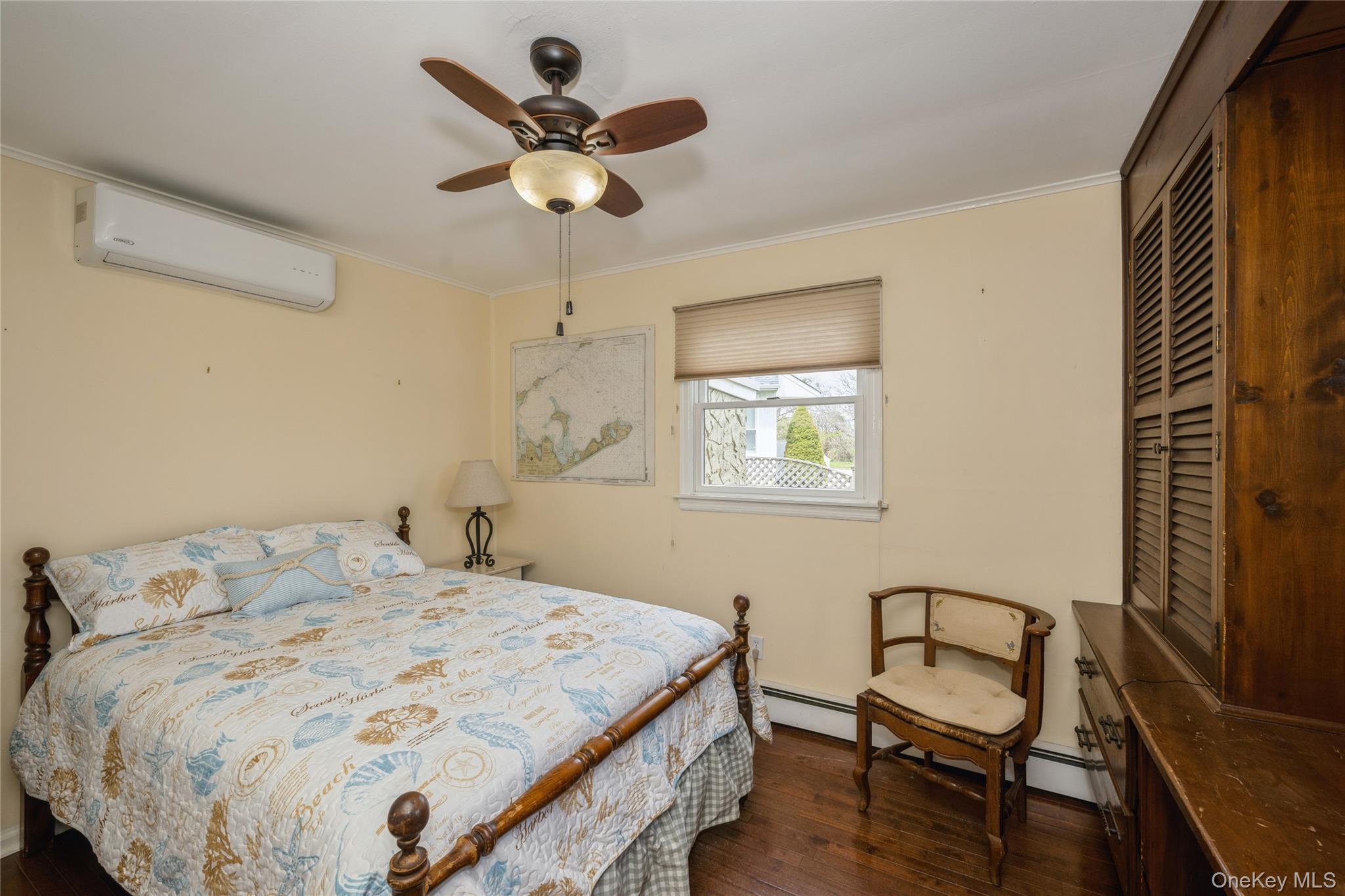 155 Essex Street Montauk, NY 11954 - Photo 7 of 11 a bedroom with a bed and a window